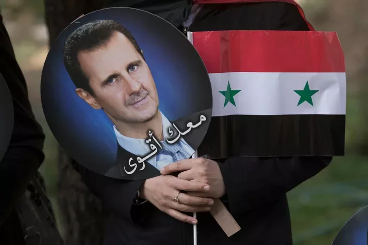 флаг Сирии и портрет Башара Асада флаг Сирии и портрет Башара Асада