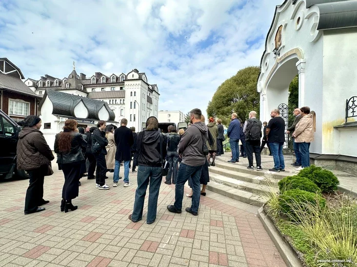 A group of people, likely family and friends, standing together outside a church